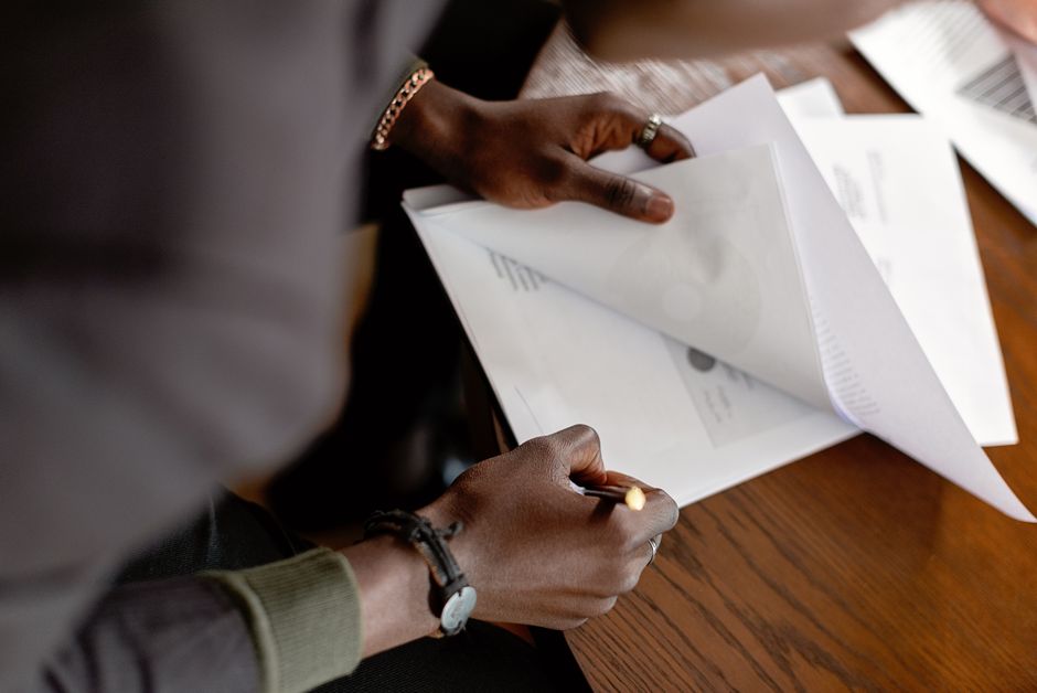researcher signing classified government nondisclosure document